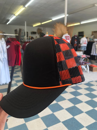 Black and orange checkered trucker hat