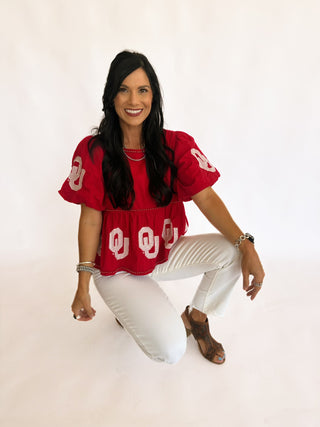 Sequin OU peplum top with pearl detail