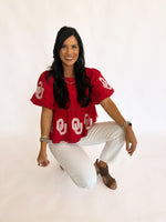 Sequin OU peplum top with pearl detail