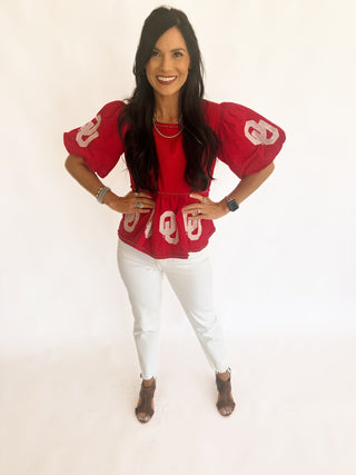 Sequin OU peplum top with pearl detail