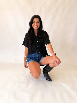 Rodeo grounds black top with concho buttons