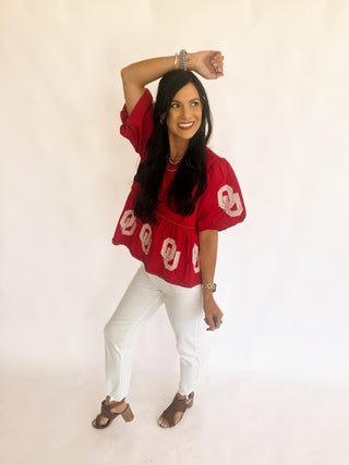 Sequin OU peplum top with pearl detail